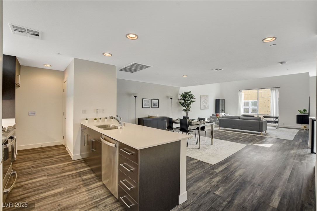 1998 Lewis Avenue Las Vegas, NV 89101 - Photo 11 of 48 Luxury plank flooring adds charm to this open layout, with the balcony just steps away.