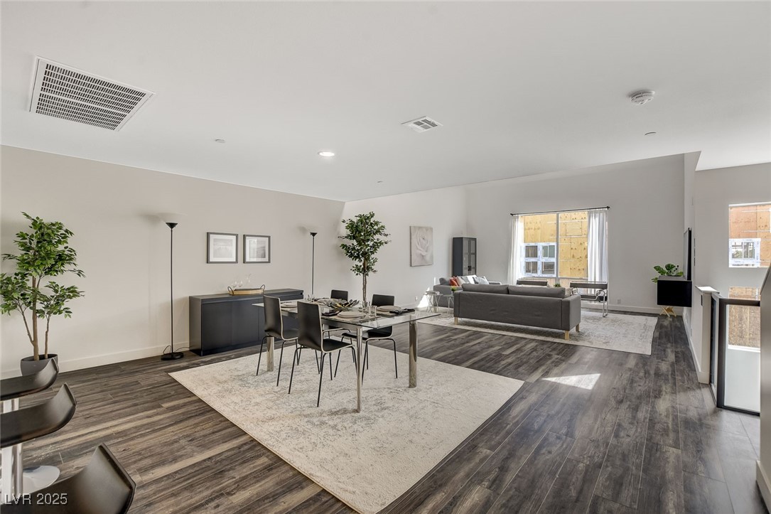 1998 Lewis Avenue Las Vegas, NV 89101 - Photo 12 of 48 Positioned between the kitchen and living room, the dining space feels both central and relaxed.