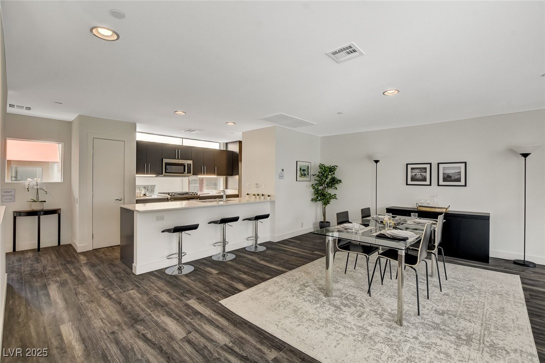 1998 Lewis Avenue Las Vegas, NV 89101 - Photo 16 of 48 This open-concept space combines dining and living areas under a vaulted ceiling, with ample natural light!