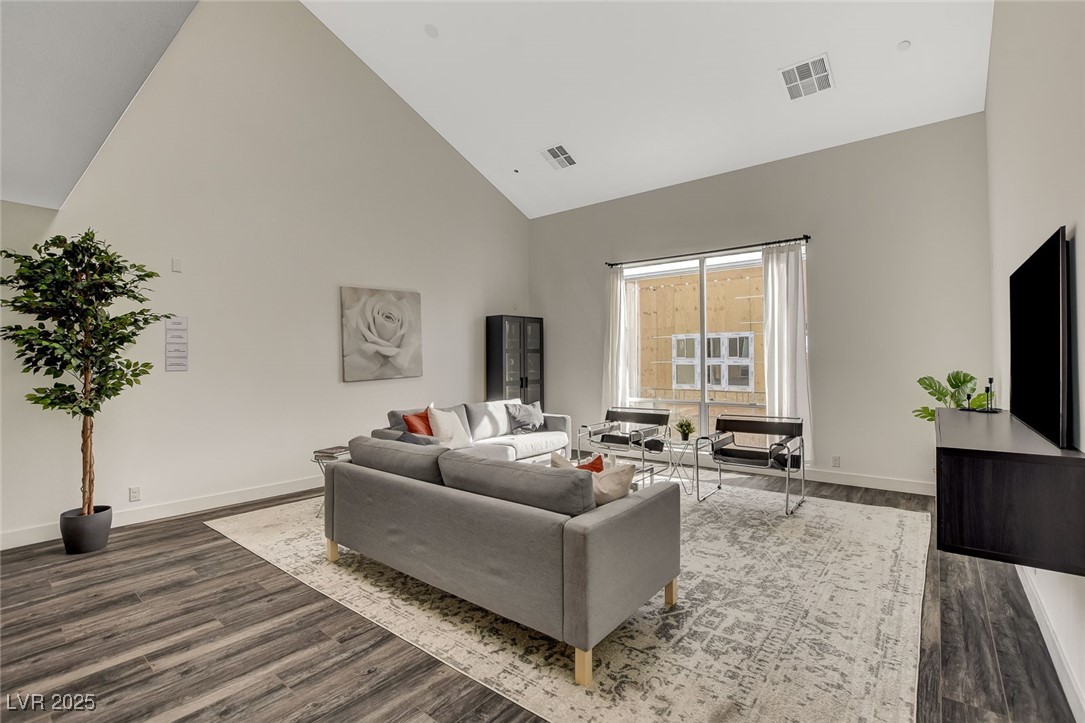 1998 Lewis Avenue Las Vegas, NV 89101 - Photo 17 of 48 Soaring vaulted ceilings and luxury plank flooring set the tone for this open, connected living space.