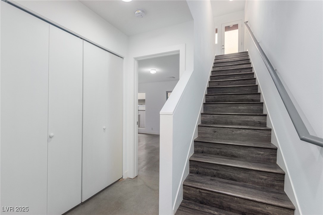 1998 Lewis Avenue Las Vegas, NV 89101 - Photo 2 of 48 Step inside to a refined entryway with stairs lead the way to the upper level.