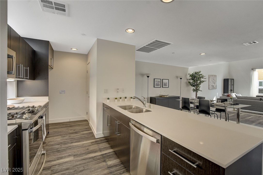 1998 Lewis Avenue Las Vegas, NV 89101 - Photo 25 of 48 Positioned perfectly for hosting, the large island looks out toward the living and dining area.