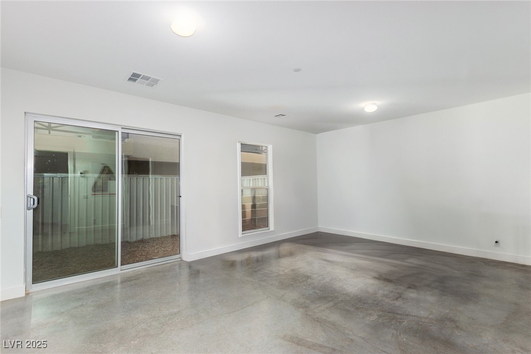 1998 Lewis Avenue Las Vegas, NV 89101 - Photo 3 of 48 Set apart from the main living areas, this lower-level 2nd bedroom offers privacy, style, and a bathroom of its own.