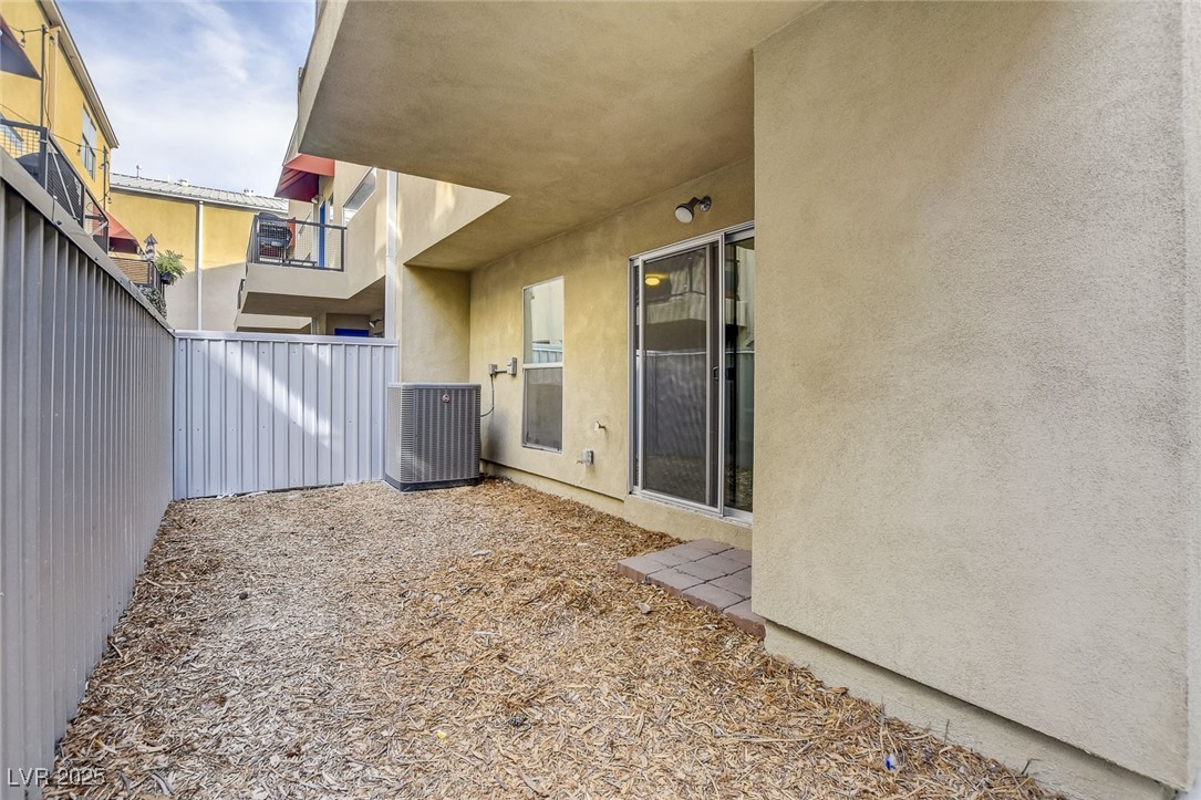 1998 Lewis Avenue Las Vegas, NV 89101 - Photo 39 of 48 The yard is fully fenced, offering a secure setting for pets, play, or quiet relaxation.