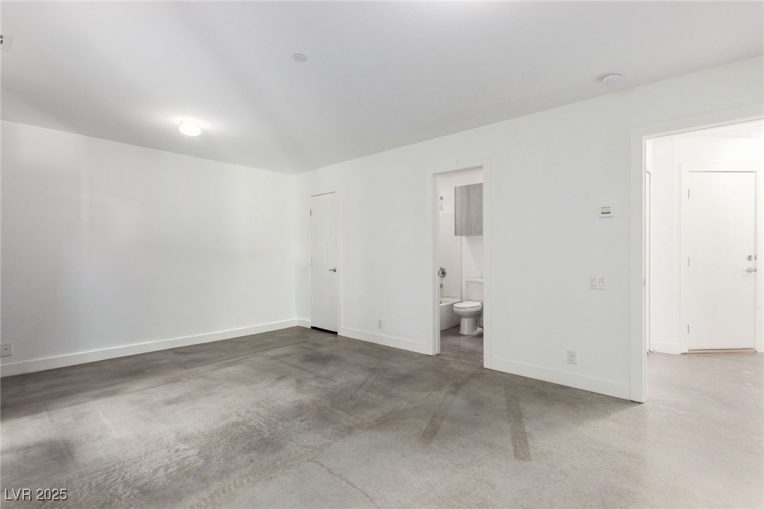 1998 Lewis Avenue Las Vegas, NV 89101 - Photo 4 of 48 The downstairs 2nd bedroom is ready for guests, work-from-home setups, or personal use.