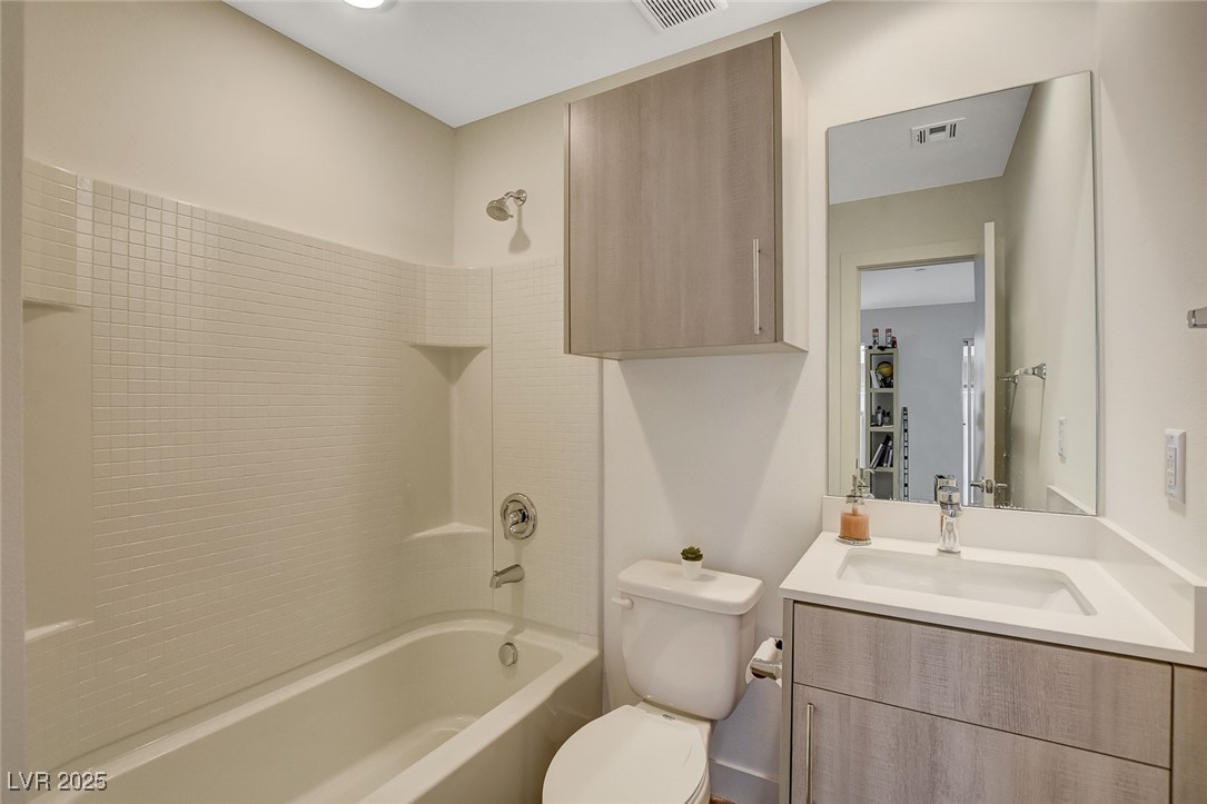 1998 Lewis Avenue Las Vegas, NV 89101 - Photo 9 of 48 With a soaking tub and shower combo, this ensuite bathroom provides a spa-like touch!