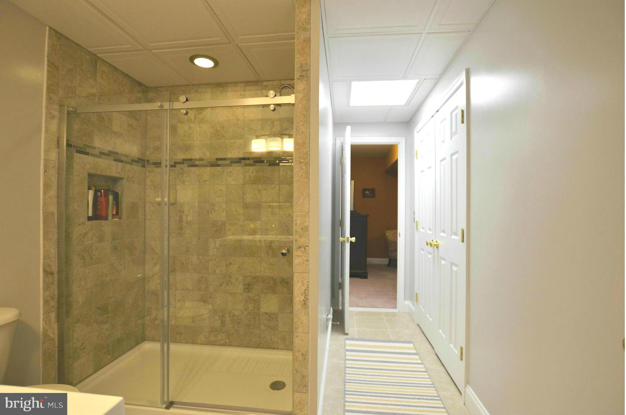 7805 Locust Wood Road Severn, MD 21144 - Photo 21 of 29 Custom tile shower/floor and more closet space!