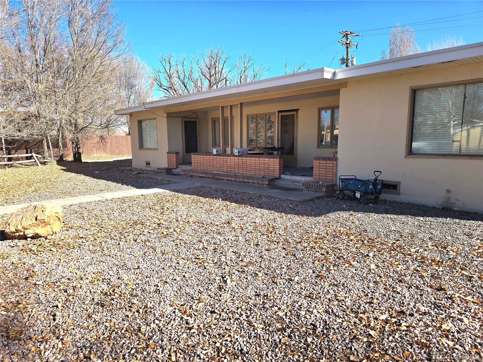 80 El Rio Drive, Unit 80 Alamosa, CO 81101 - Photo 1 of 12 a front view of a house with a yard