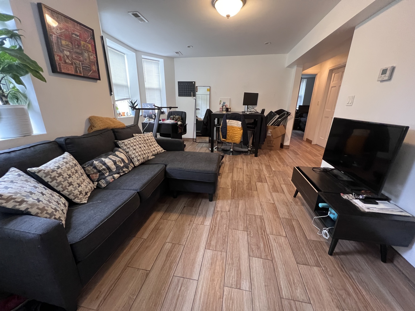 Undisclosed Address Chicago, IL 60618 - Photo 2 of 13 a living room with furniture and a flat screen tv