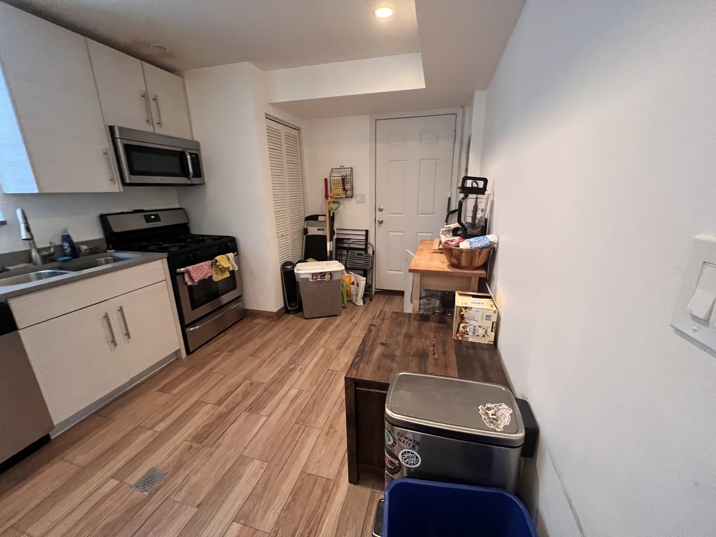 Undisclosed Address Chicago, IL 60618 - Photo 5 of 13 a living room with furniture and a flat screen tv