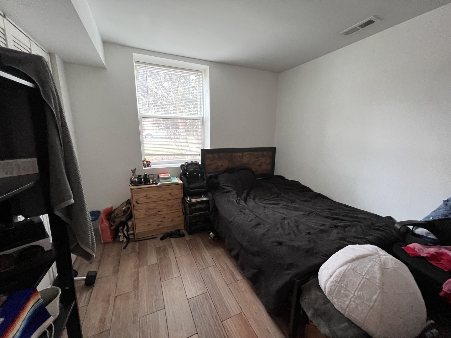 Undisclosed Address Chicago, IL 60618 - Photo 9 of 13 a living room with furniture and a flat screen tv