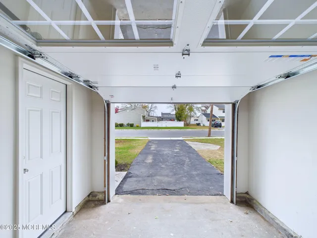 a view of back yard of the house with green space