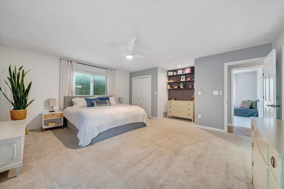 6925 Shaver Road Roanoke, VA 24018 - Photo 51 of 94 a spacious bedroom with a large bed and a potted plant