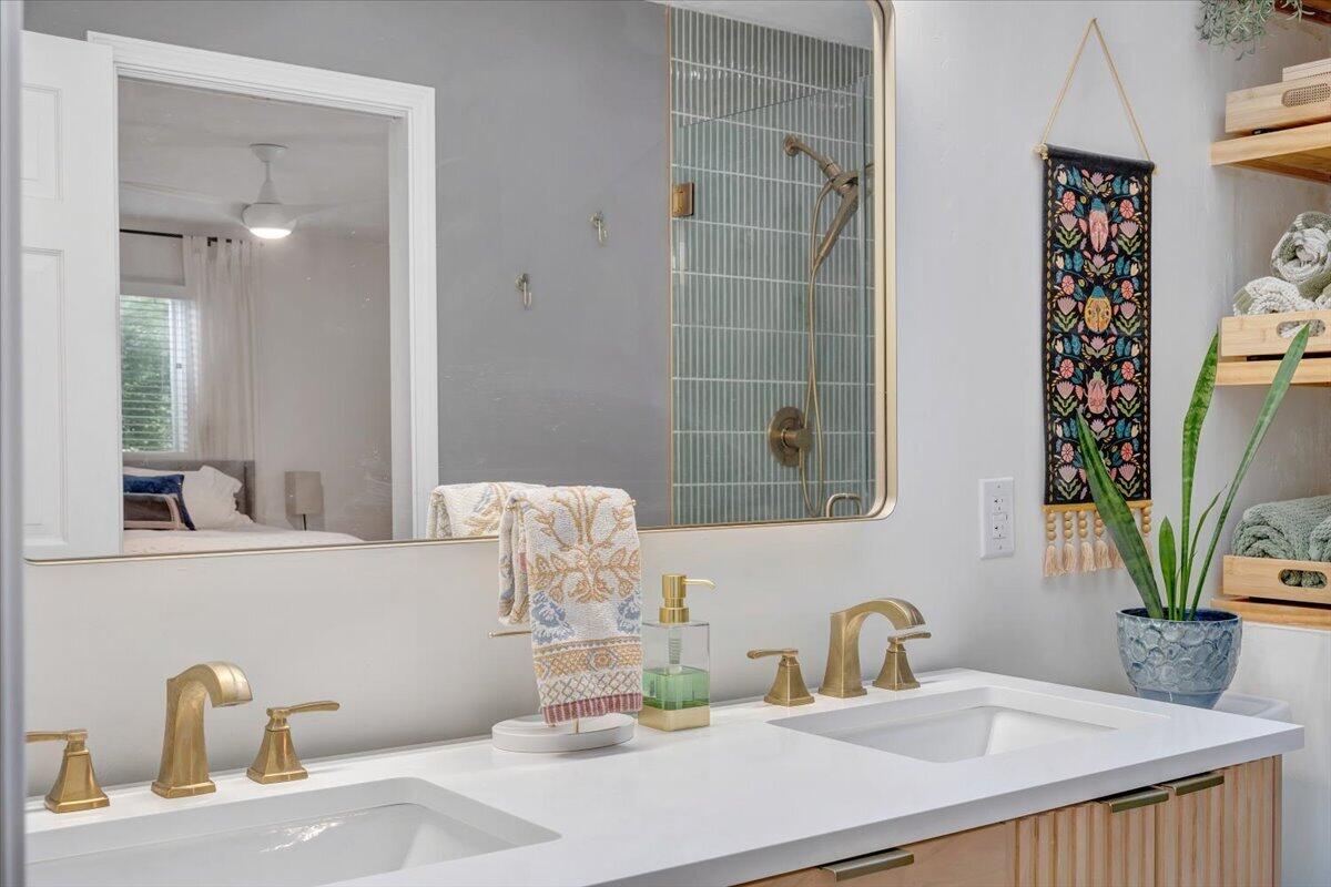 6925 Shaver Road Roanoke, VA 24018 - Photo 55 of 94 a bathroom with a granite countertop sink a mirror and shower