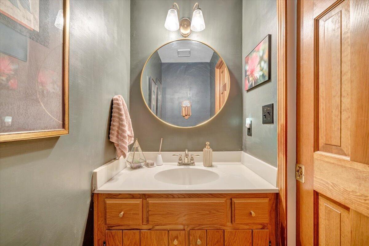 6925 Shaver Road Roanoke, VA 24018 - Photo 58 of 94 a bathroom with a sink and a mirror