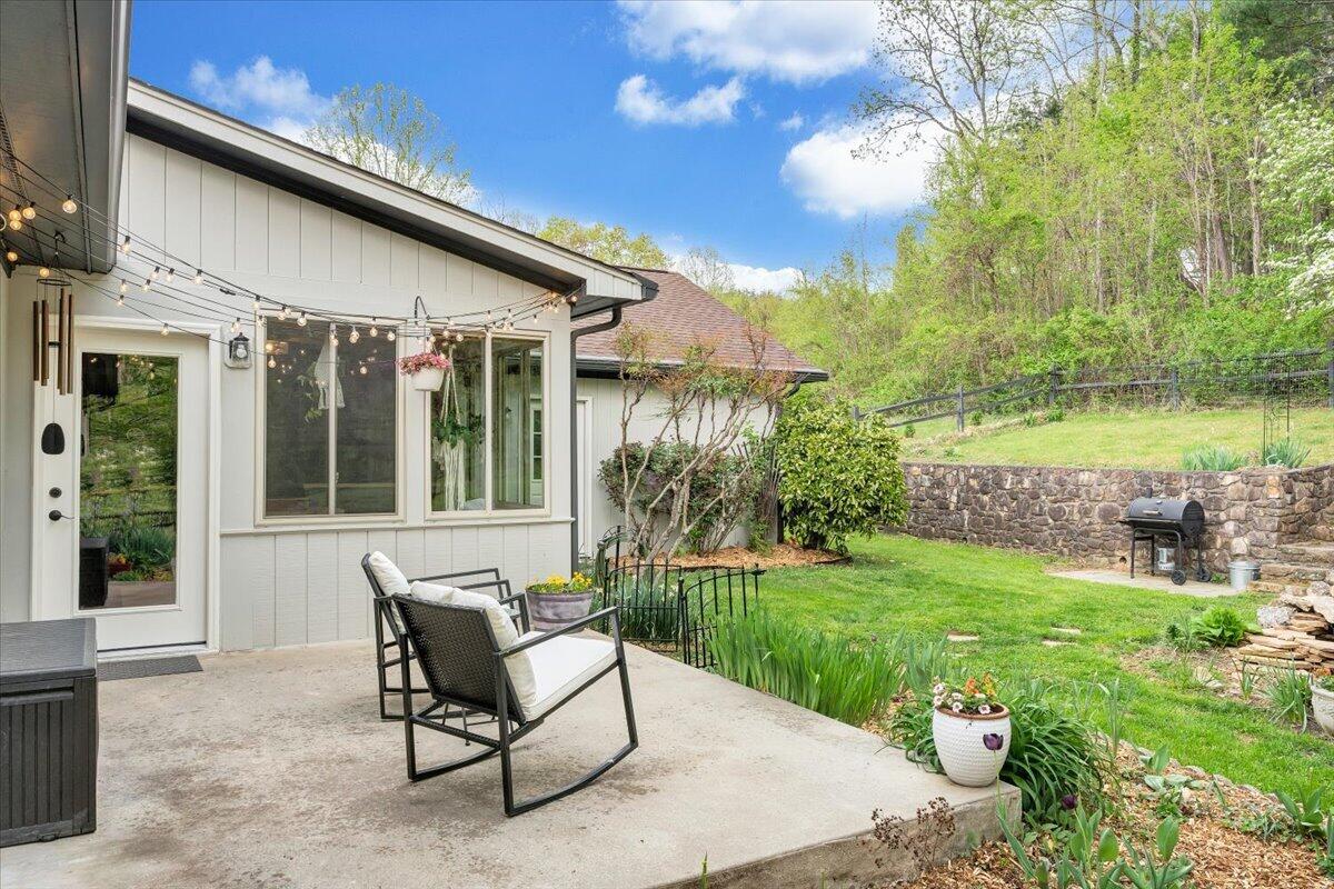 6925 Shaver Road Roanoke, VA 24018 - Photo 66 of 94 a view of a chair and table in backyard of the house