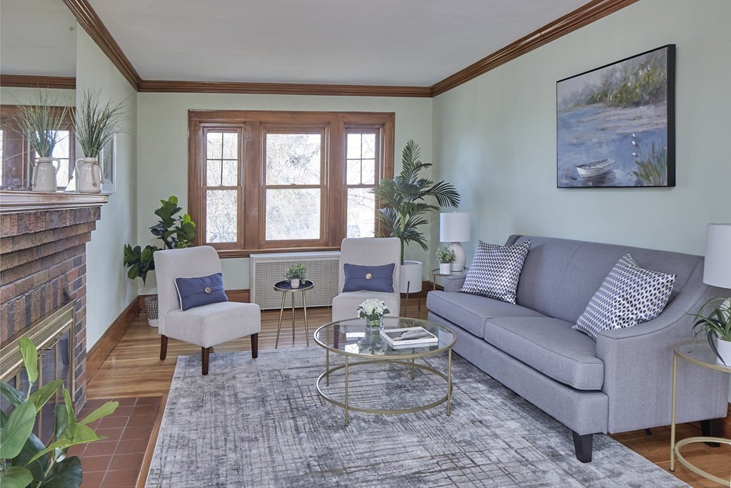77 Standish Road Watertown, MA 02472 - Photo 3 of 16 a living room with furniture and a large window