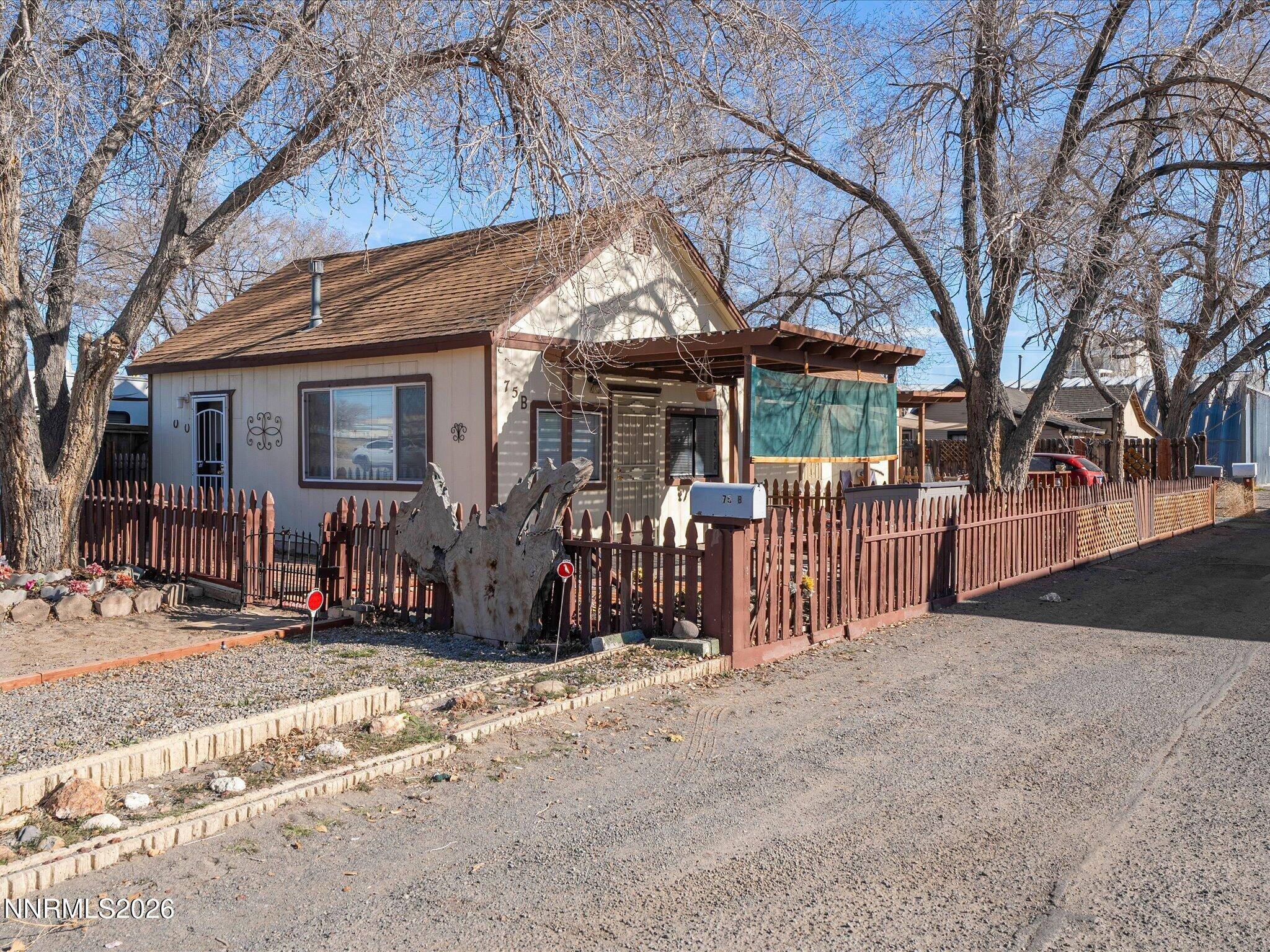 75 South Center Street, Unit A B Fernley, NV 89408 - Photo 2 of 41 a view of a house with wooden fence