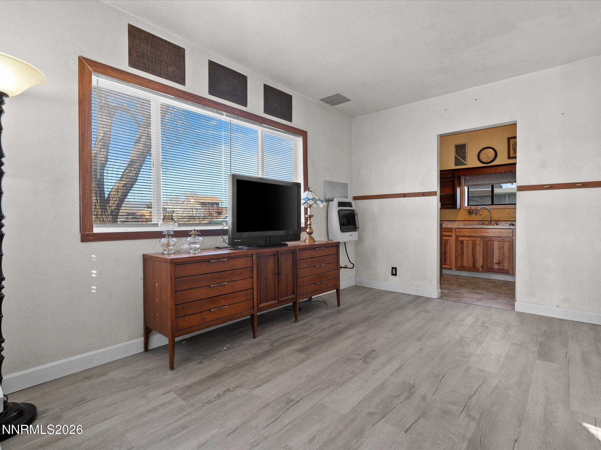 75 South Center Street, Unit A B Fernley, NV 89408 - Photo 21 of 41 a view of room with furniture and wooden floor