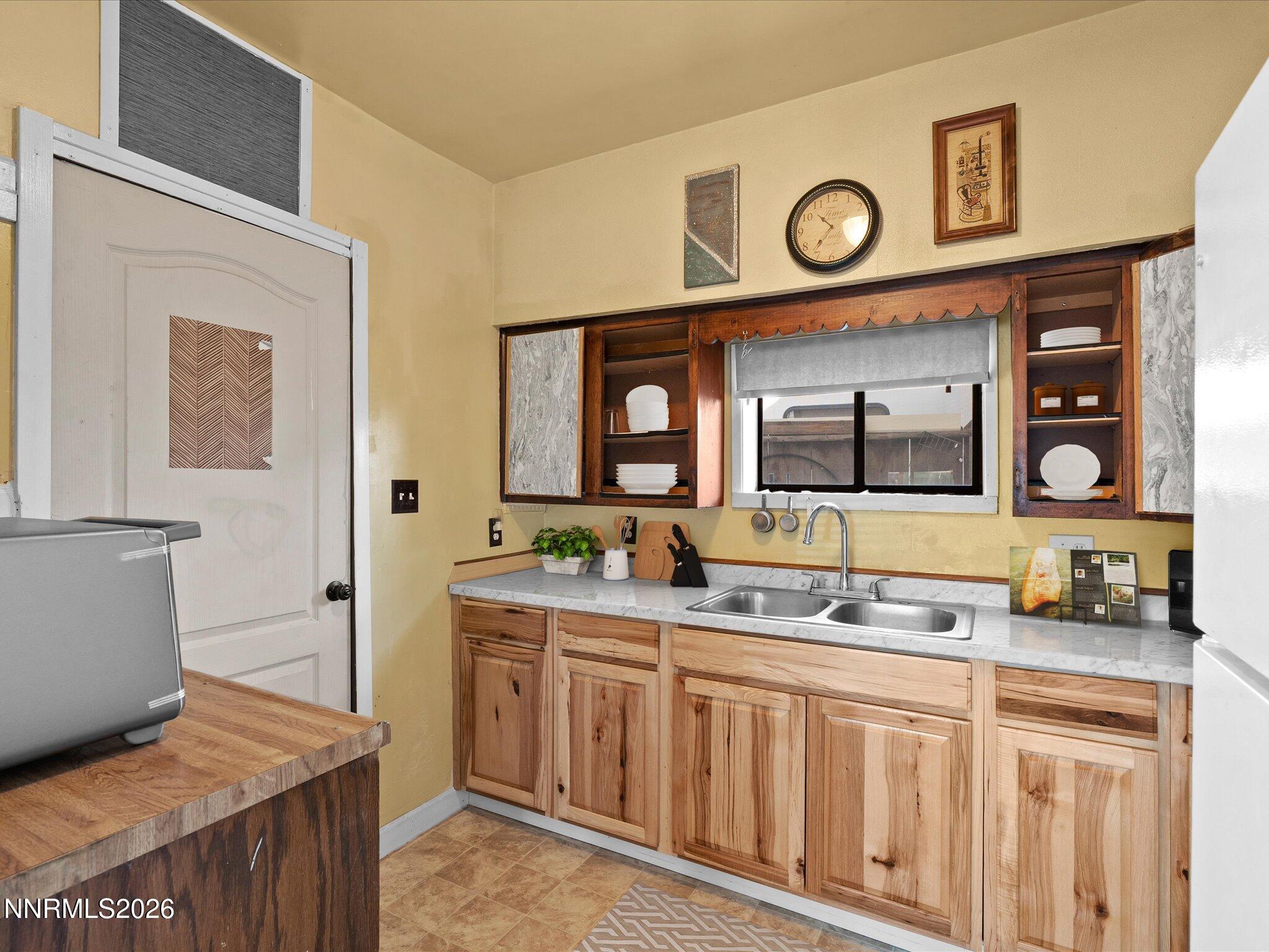 75 South Center Street, Unit A B Fernley, NV 89408 - Photo 27 of 41 a bathroom with a sink and a large mirror