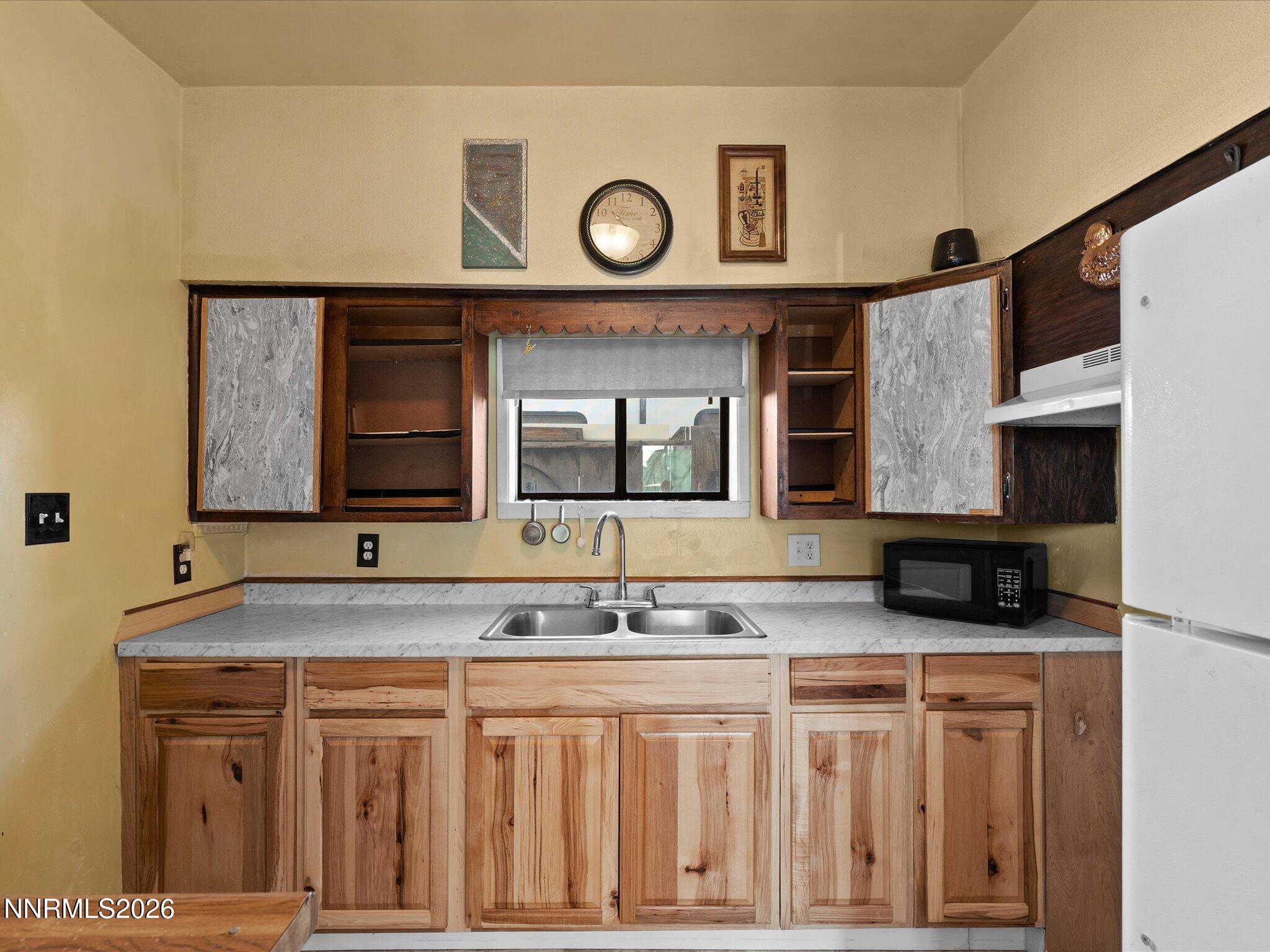 75 South Center Street, Unit A B Fernley, NV 89408 - Photo 29 of 41 a bathroom with a granite countertop sink and a mirror