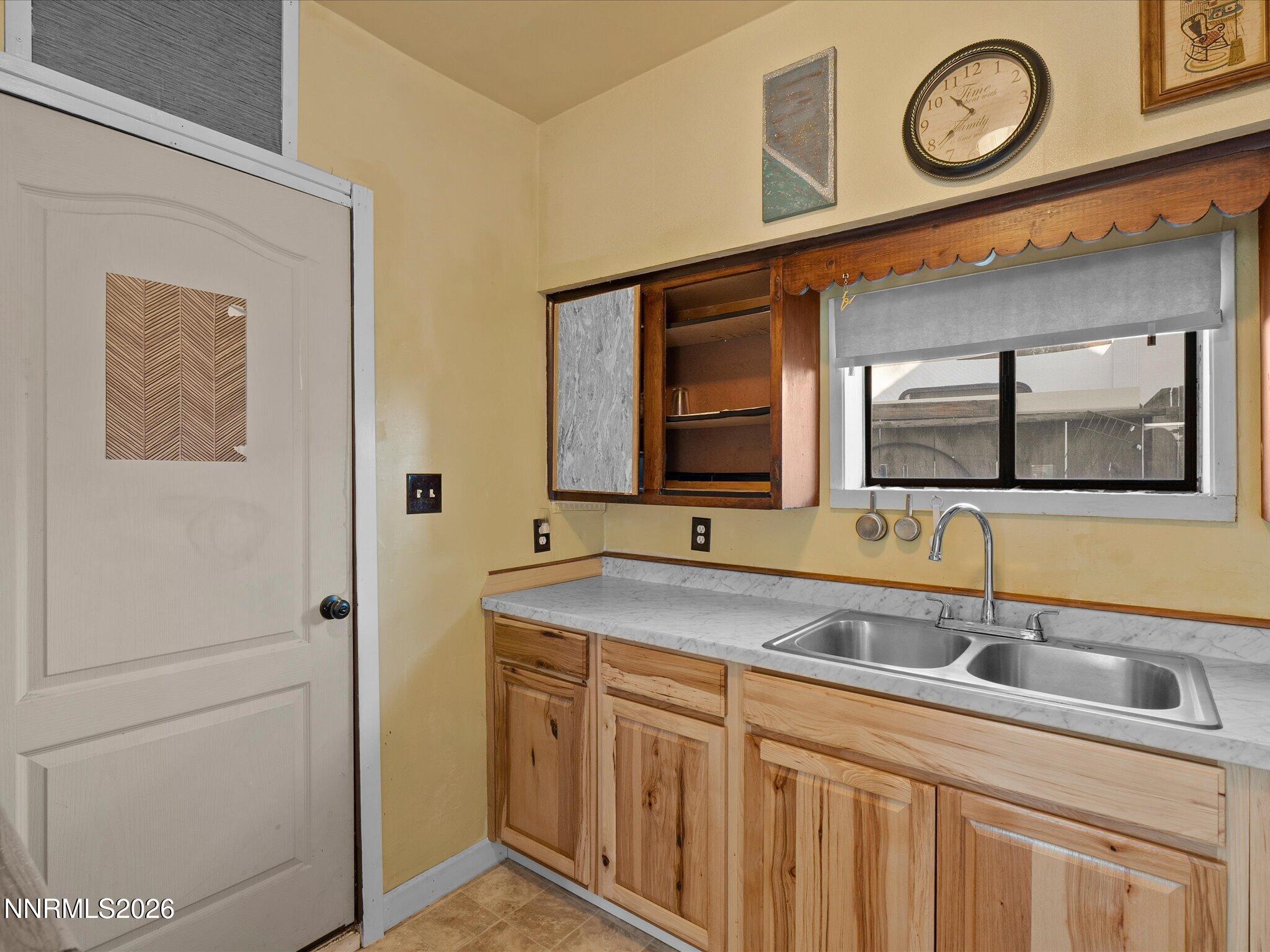 75 South Center Street, Unit A B Fernley, NV 89408 - Photo 31 of 41 a bathroom with a sink and a mirror