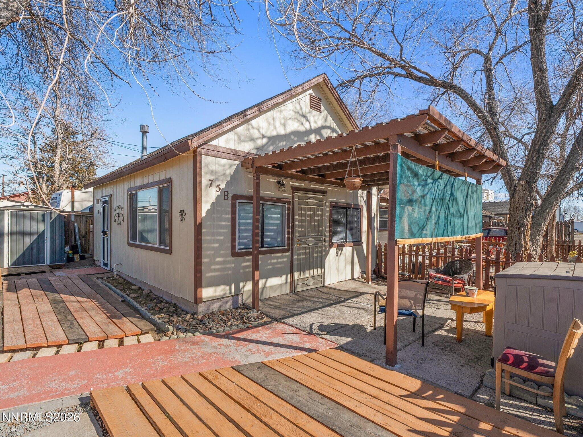 75 South Center Street, Unit A B Fernley, NV 89408 - Photo 6 of 41 a view of a patio with a chairs and table in the patio