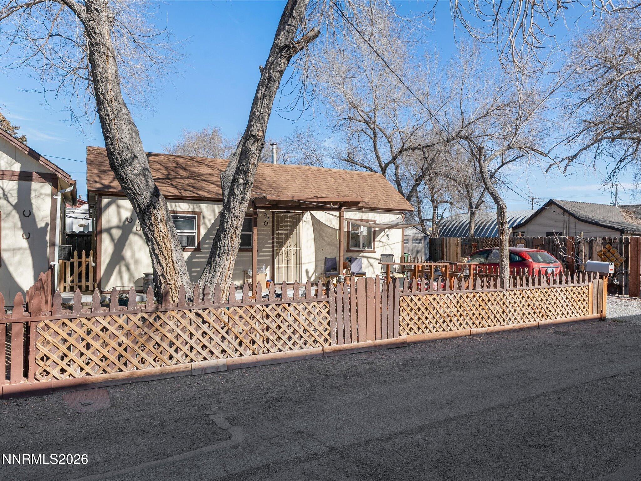 75 South Center Street, Unit A B Fernley, NV 89408 - Photo 9 of 41 a view of a house with a wooden fence