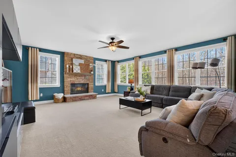 a spacious bedroom with a bed and a chair