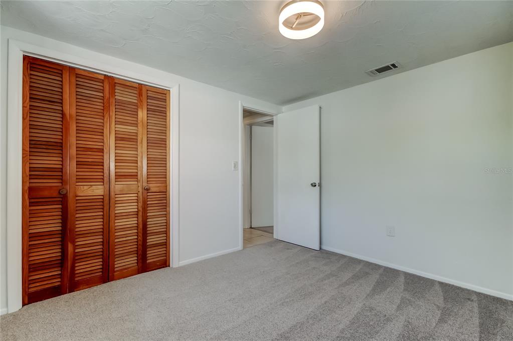 5753 Bantam Avenue New Port Richey, FL 34652 - Photo 38 of 47 an empty room with windows