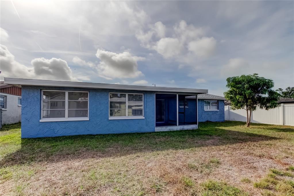 5753 Bantam Avenue New Port Richey, FL 34652 - Photo 46 of 47 a front view of a house with garden
