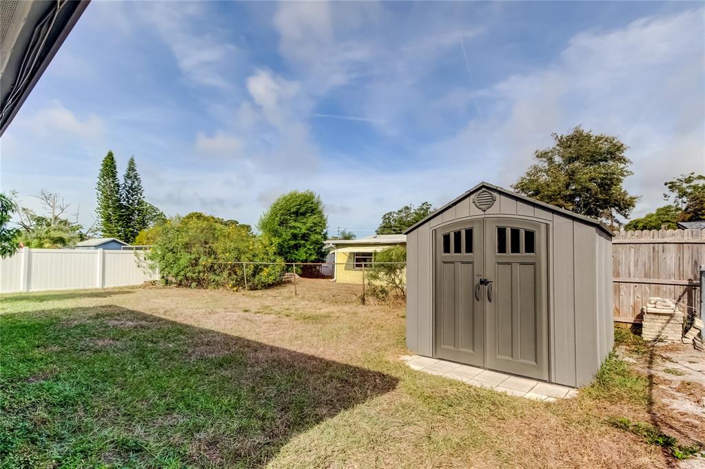 5753 Bantam Avenue New Port Richey, FL 34652 - Photo 47 of 47 a front view of a house with a yard