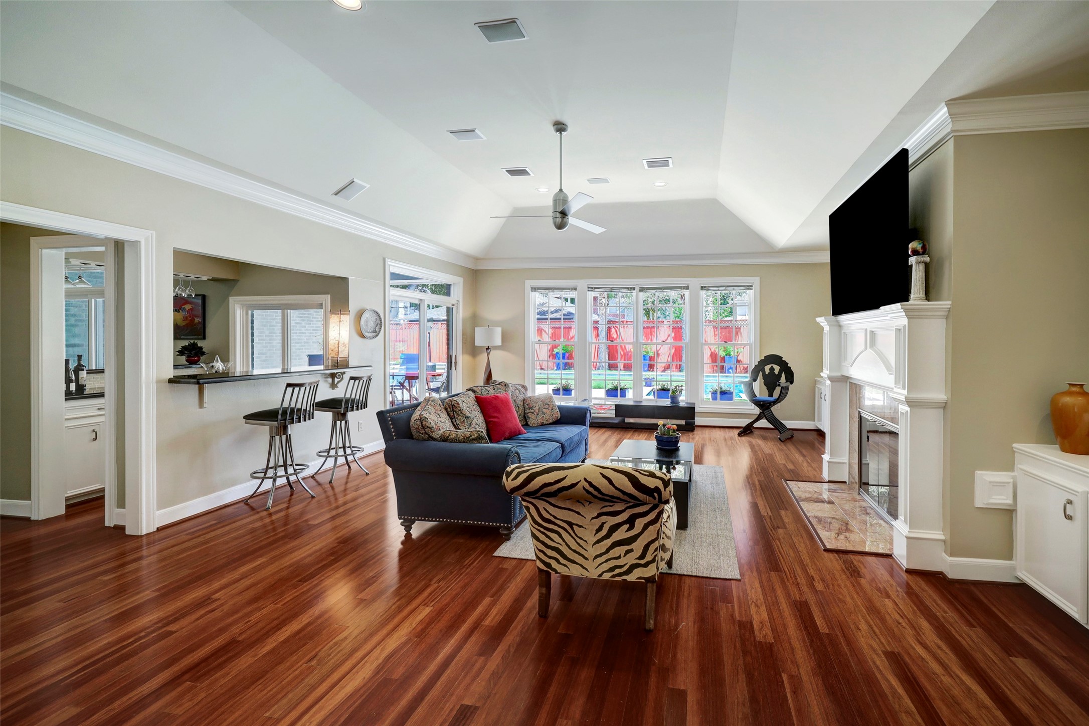 4401 Roseland Street Houston, TX 77006 - Photo 16 of 46 a living room with furniture a fireplace and a flat screen tv