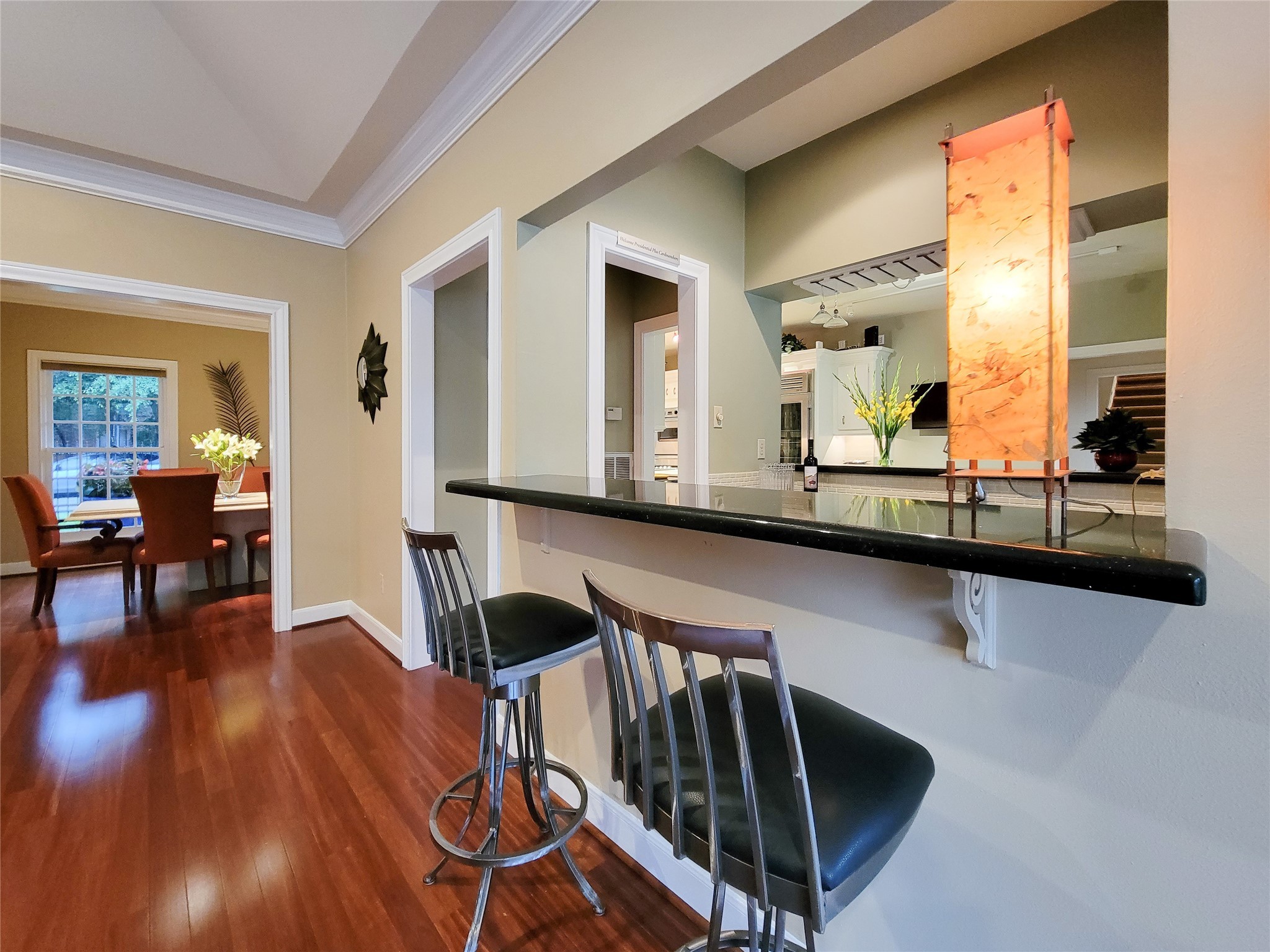 4401 Roseland Street Houston, TX 77006 - Photo 18 of 46 a living room with table chairs and wooden floors