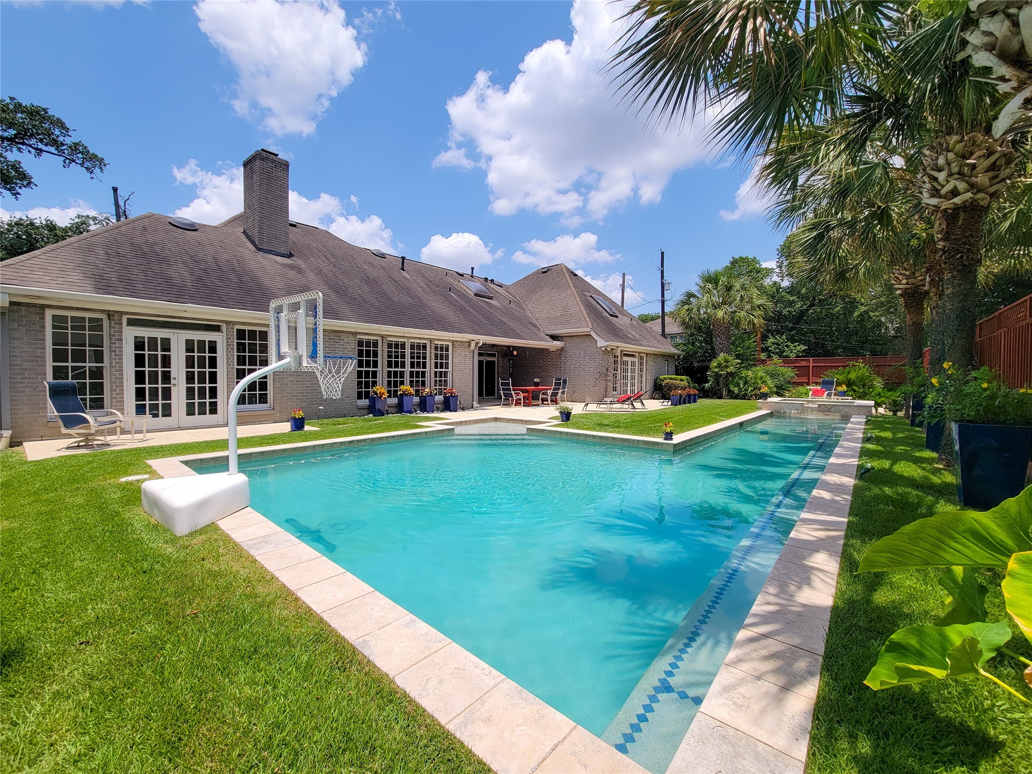 4401 Roseland Street Houston, TX 77006 - Photo 2 of 46 a front view of a house with a yard table and chairs