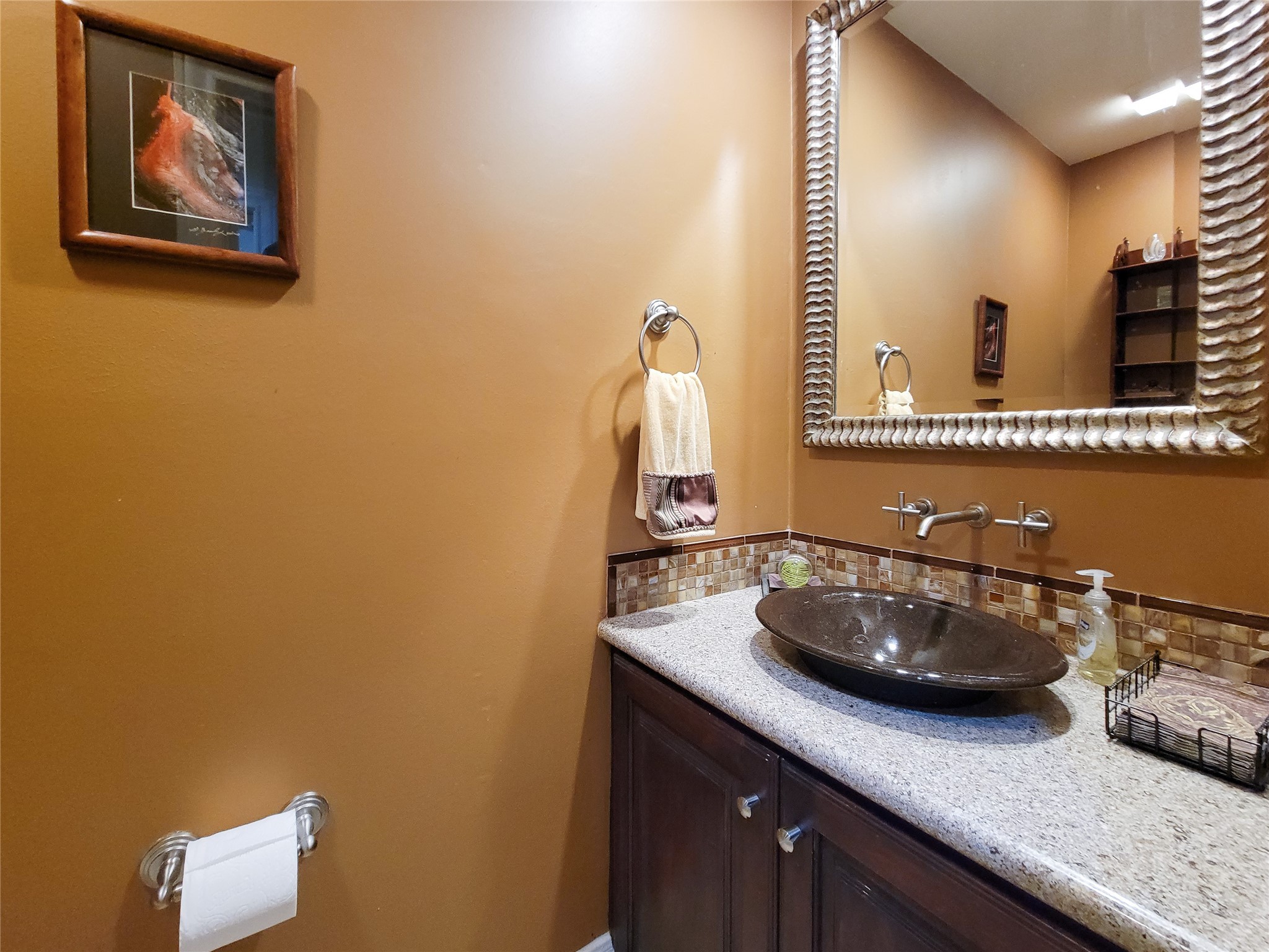 4401 Roseland Street Houston, TX 77006 - Photo 24 of 46 a bathroom with a sink and a mirror