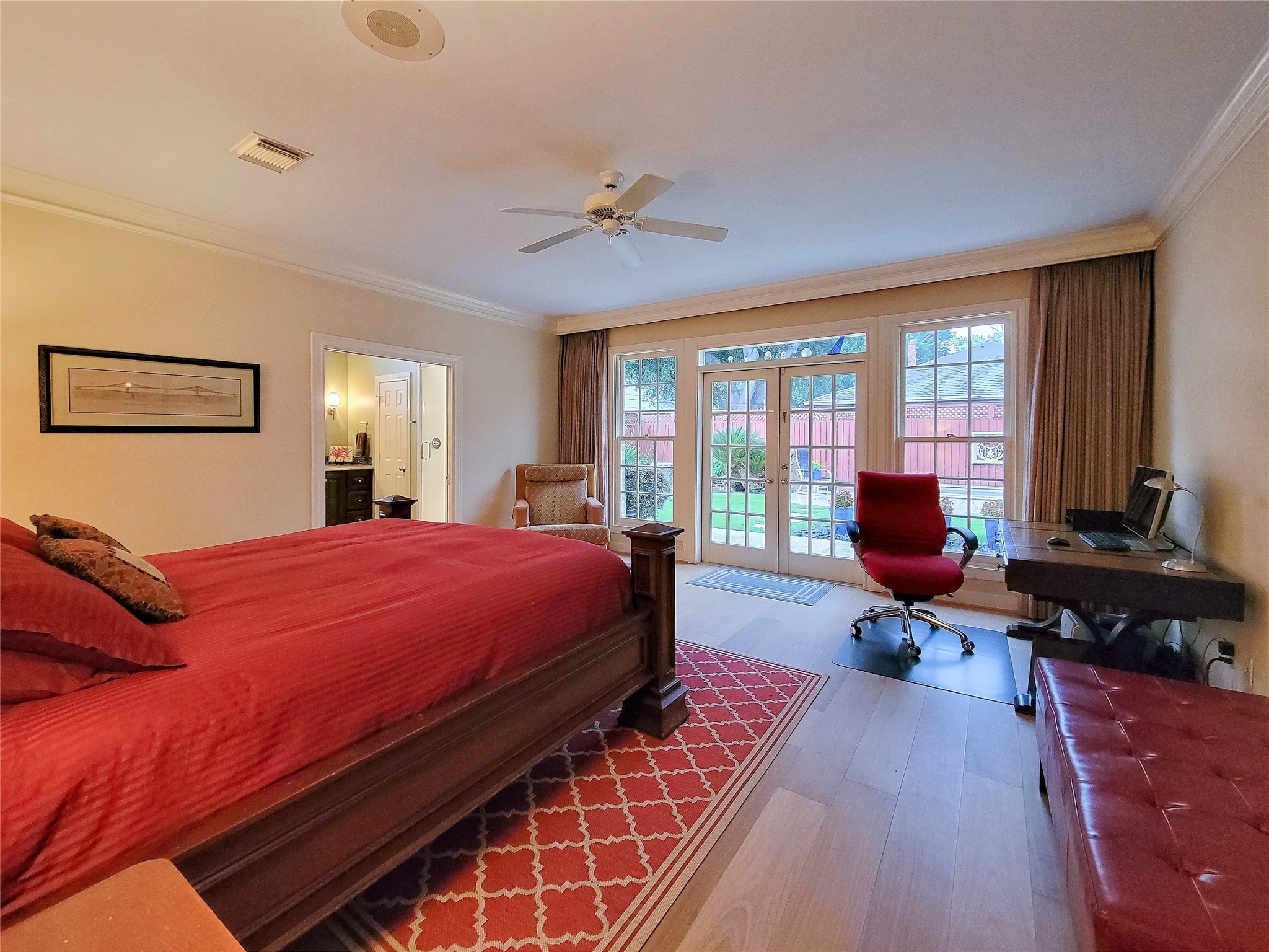 4401 Roseland Street Houston, TX 77006 - Photo 25 of 46 a bedroom with bed and glass windows