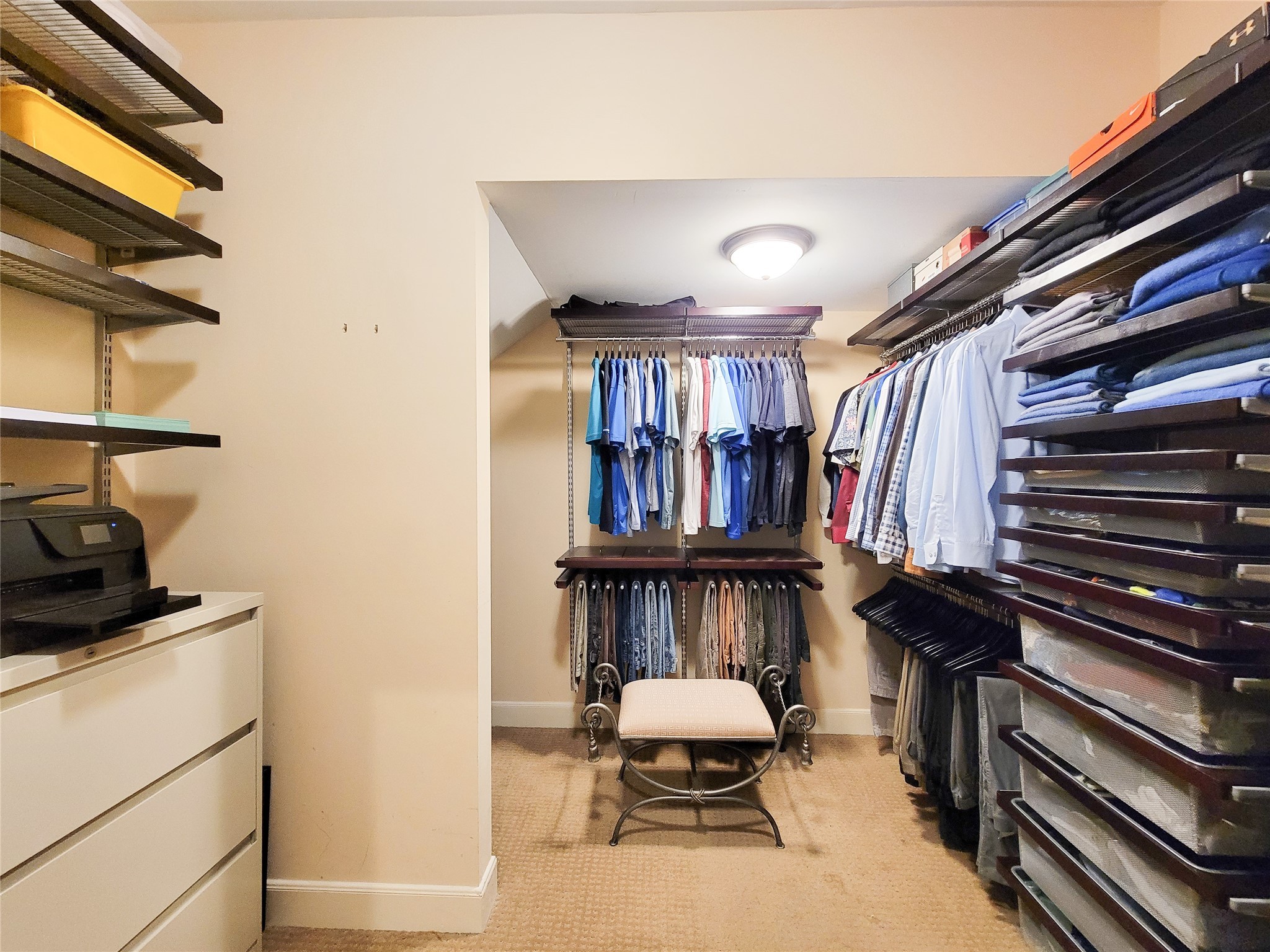 4401 Roseland Street Houston, TX 77006 - Photo 28 of 46 a view of walk in closet with clothes and shoes