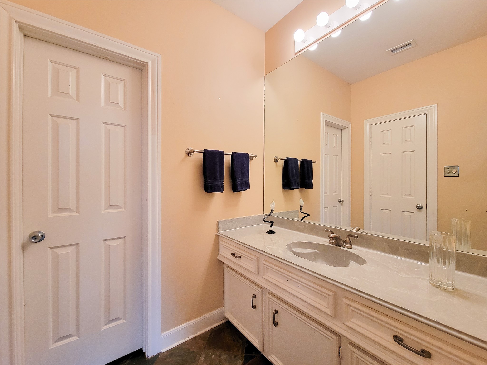 4401 Roseland Street Houston, TX 77006 - Photo 30 of 46 a bathroom with a double vanity sink and mirror