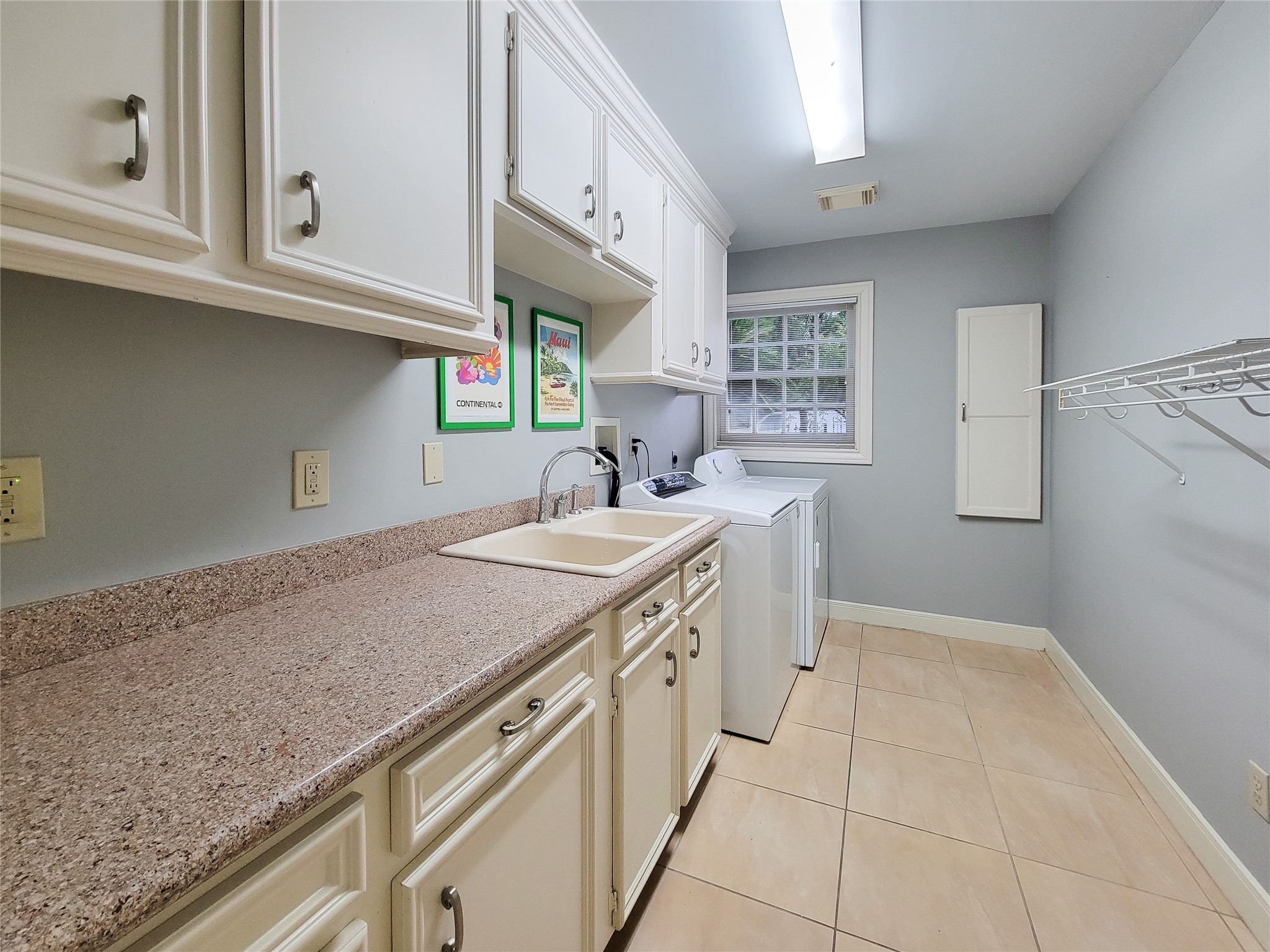4401 Roseland Street Houston, TX 77006 - Photo 37 of 46 a utility room with granite countertop a sink a vanity and dishwasher