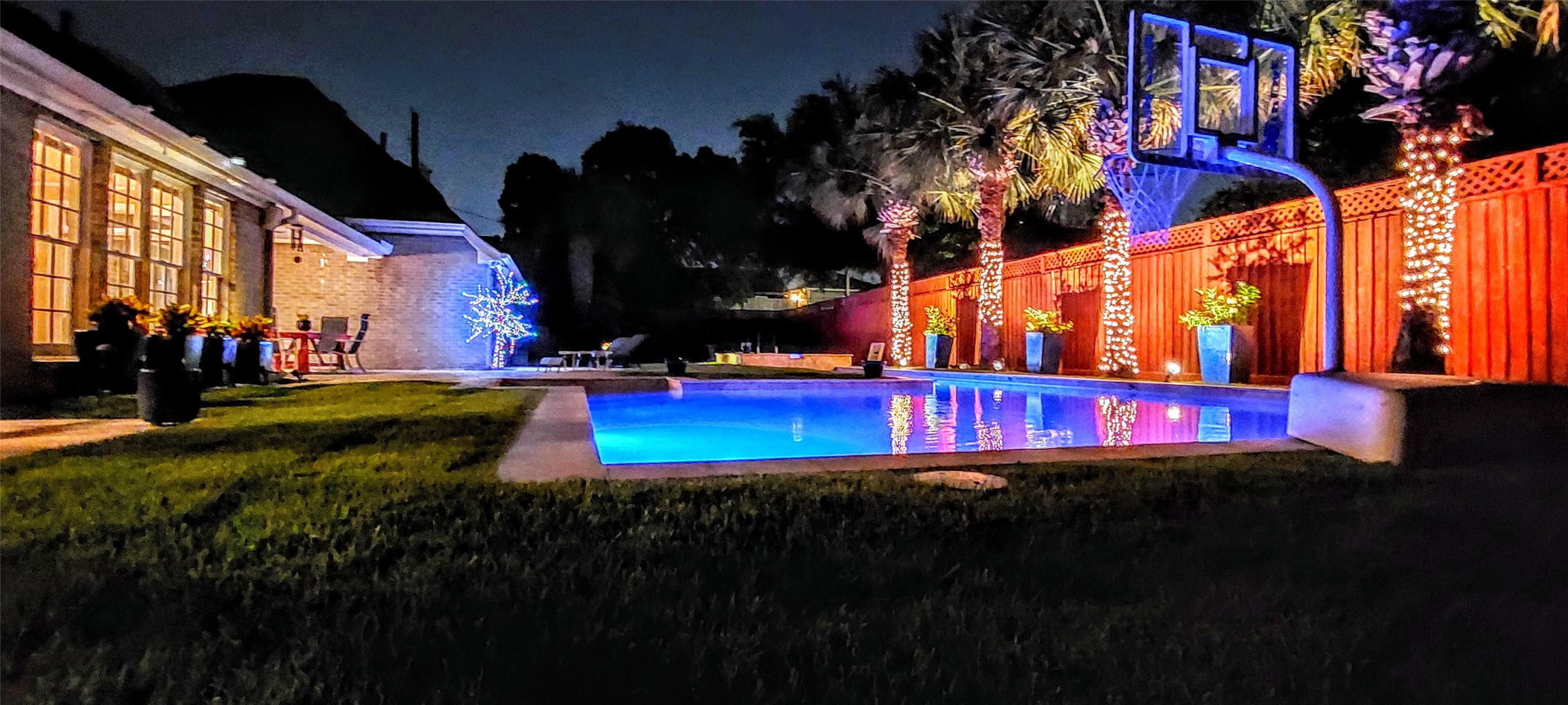 4401 Roseland Street Houston, TX 77006 - Photo 43 of 46 a view of yard with swimming pool and trees in the background