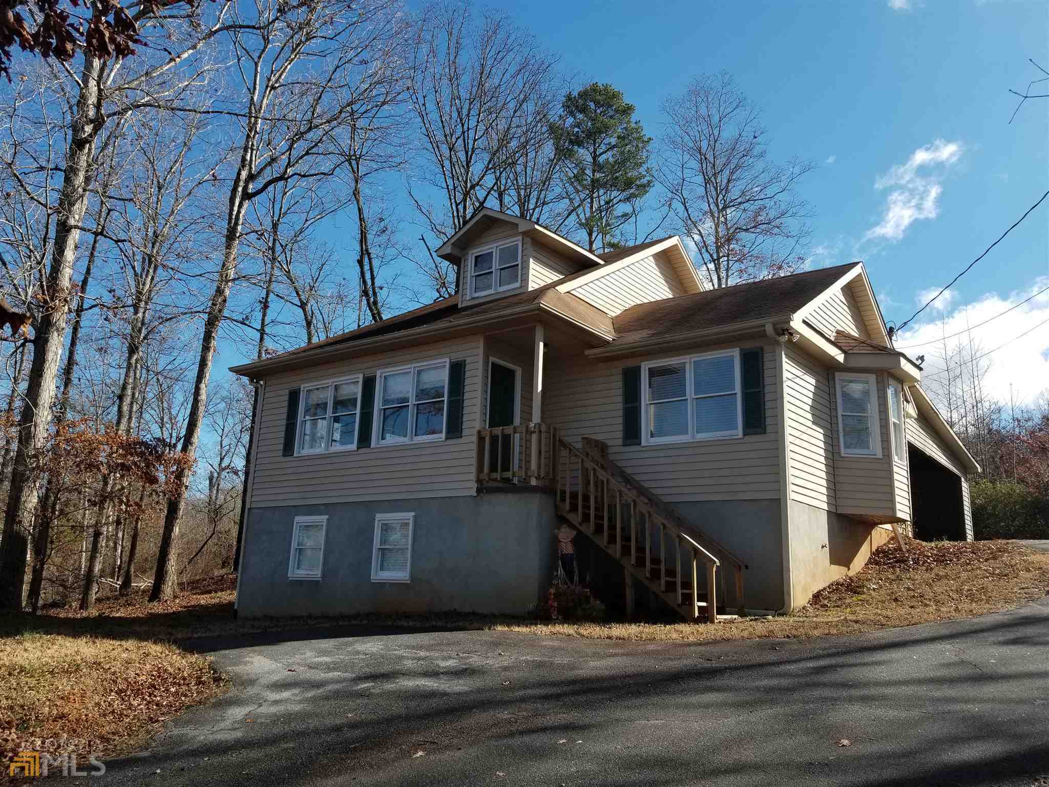 a view of a house with a street