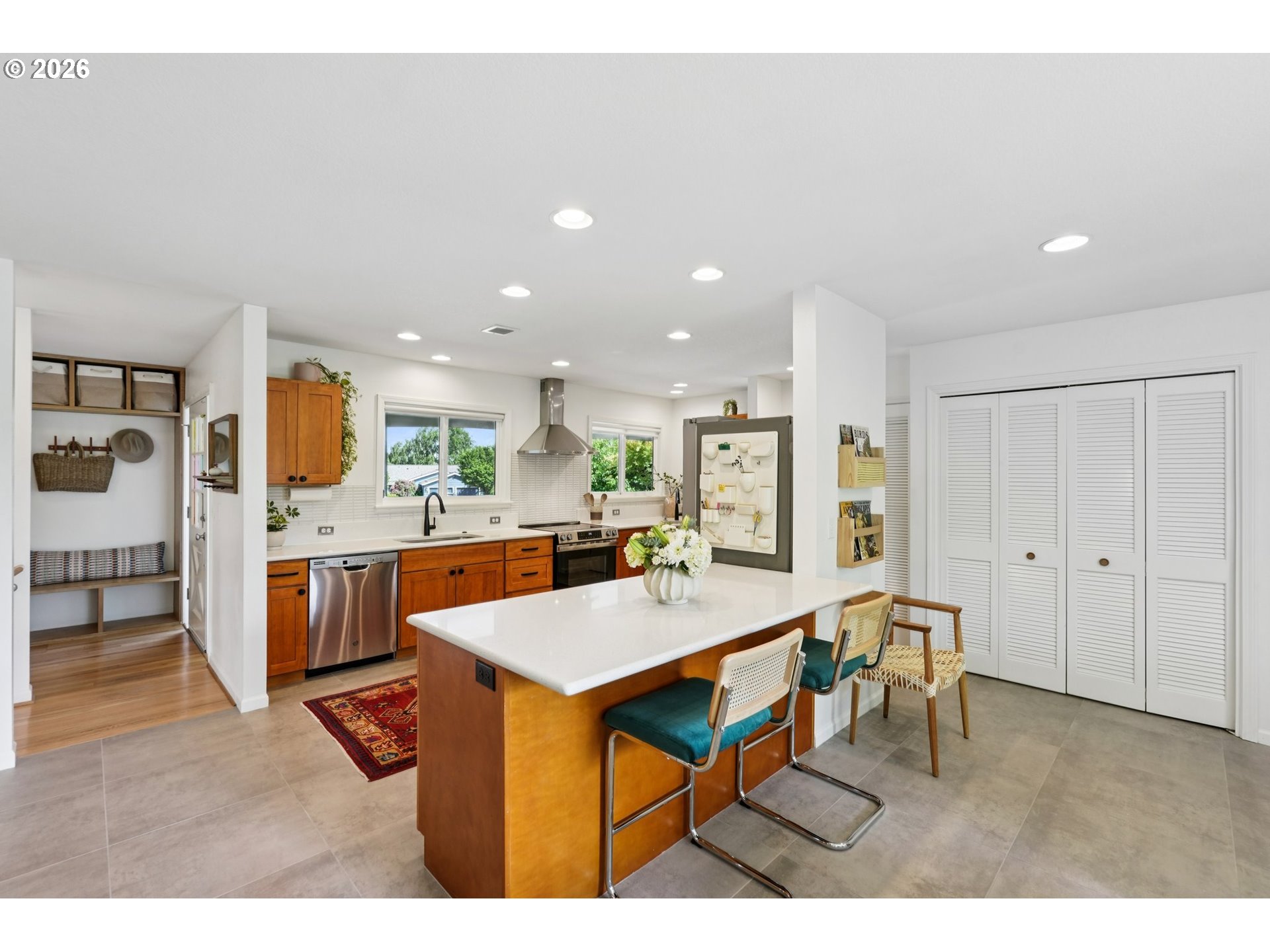 7225 Southwest 13th Avenue Portland, OR 97219 - Photo 16 of 48 a kitchen with a table and chairs in it