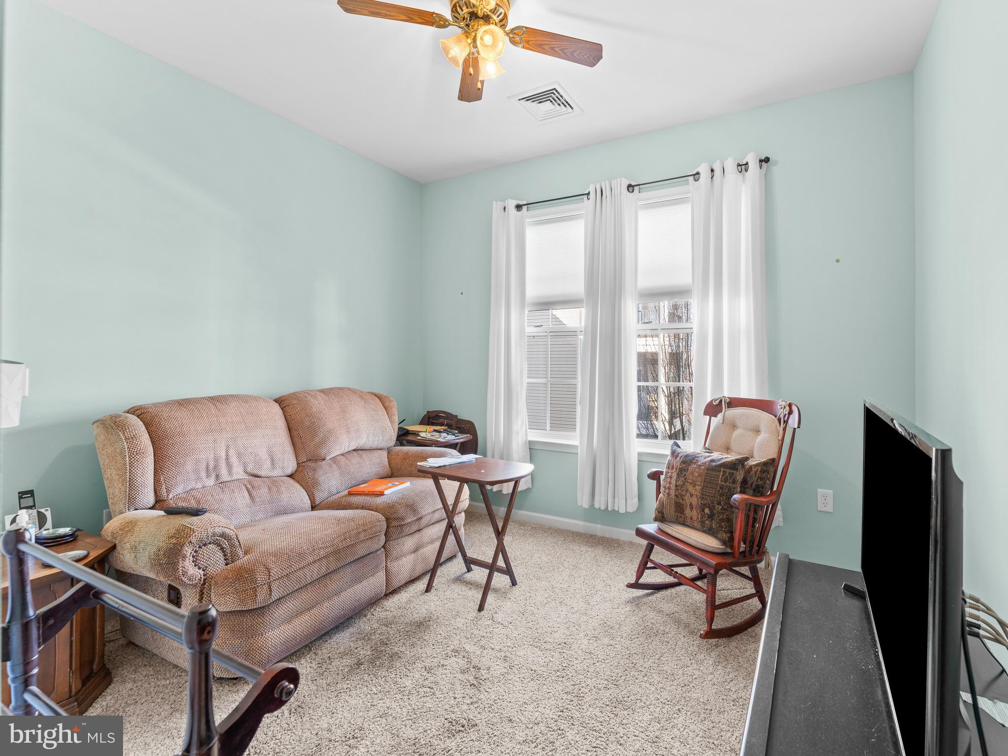 522 Creekside Drive Brookhaven, PA 19015 - Photo 13 of 28 a living room with furniture and a floor to ceiling window