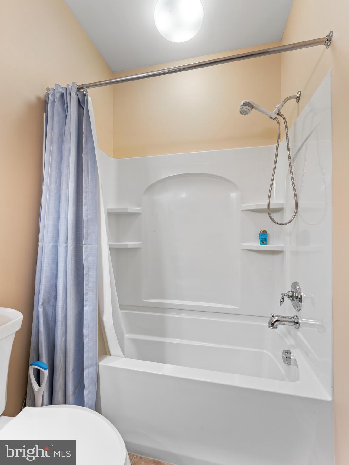 522 Creekside Drive Brookhaven, PA 19015 - Photo 16 of 28 a bathroom with a shower a toilet and a tub