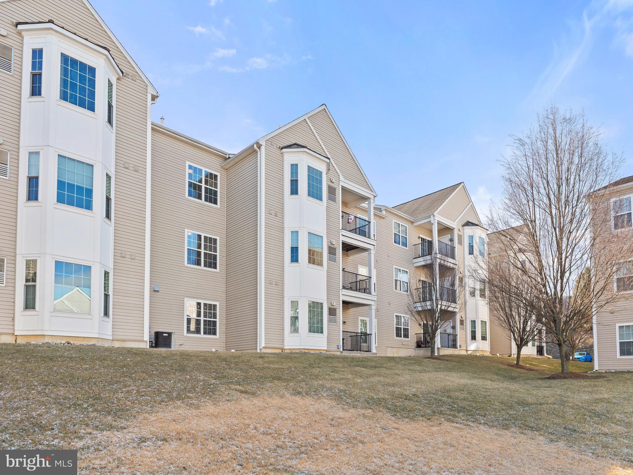 522 Creekside Drive Brookhaven, PA 19015 - Photo 24 of 28 a front view of residential houses with yard and trees