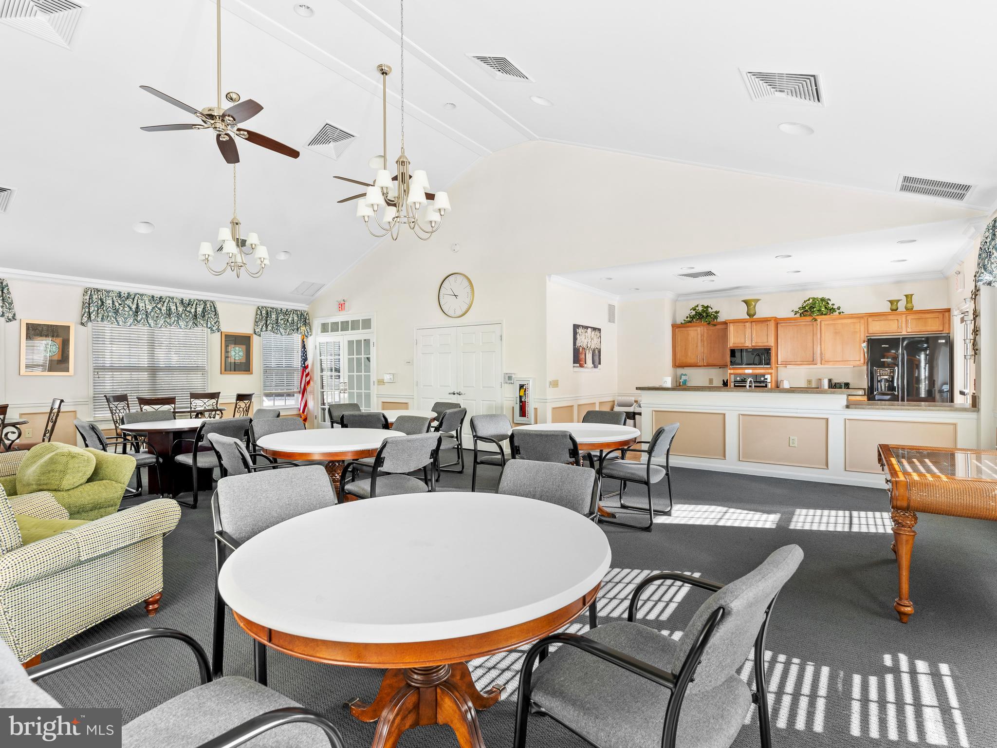 522 Creekside Drive Brookhaven, PA 19015 - Photo 27 of 28 a living room with furniture a rug and a chandelier