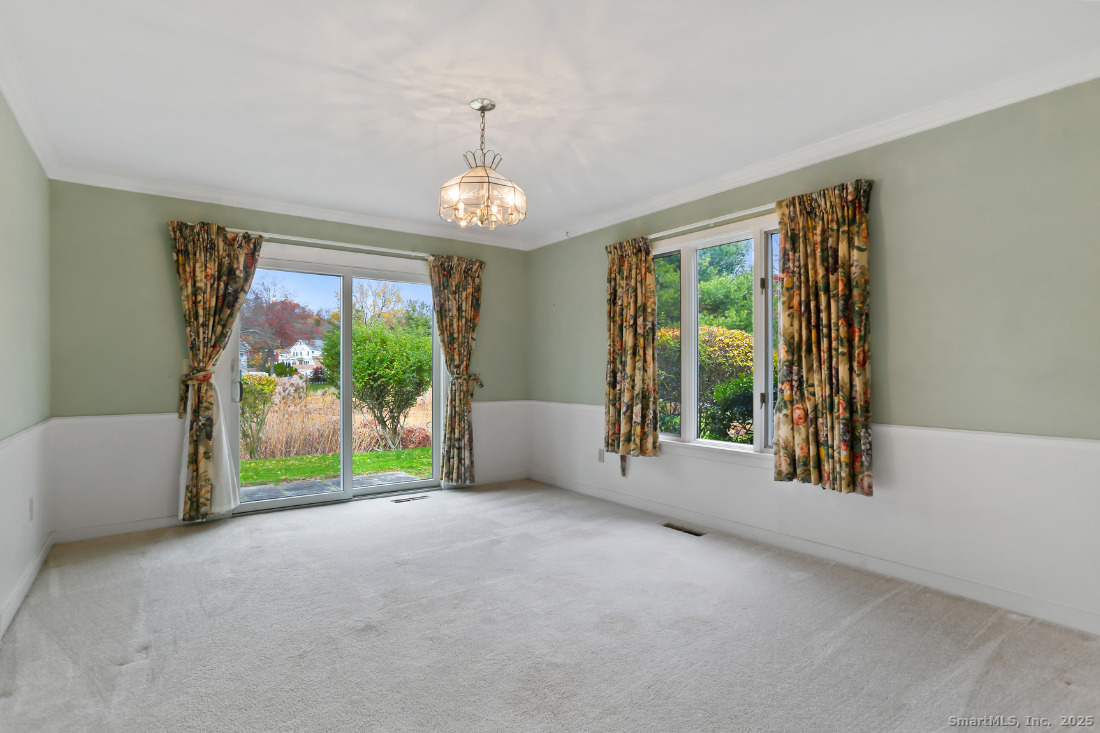 97 Field Point Drive, Unit 97 Fairfield, CT 06824 - Photo 12 of 40 a view of room with window and ceiling fan