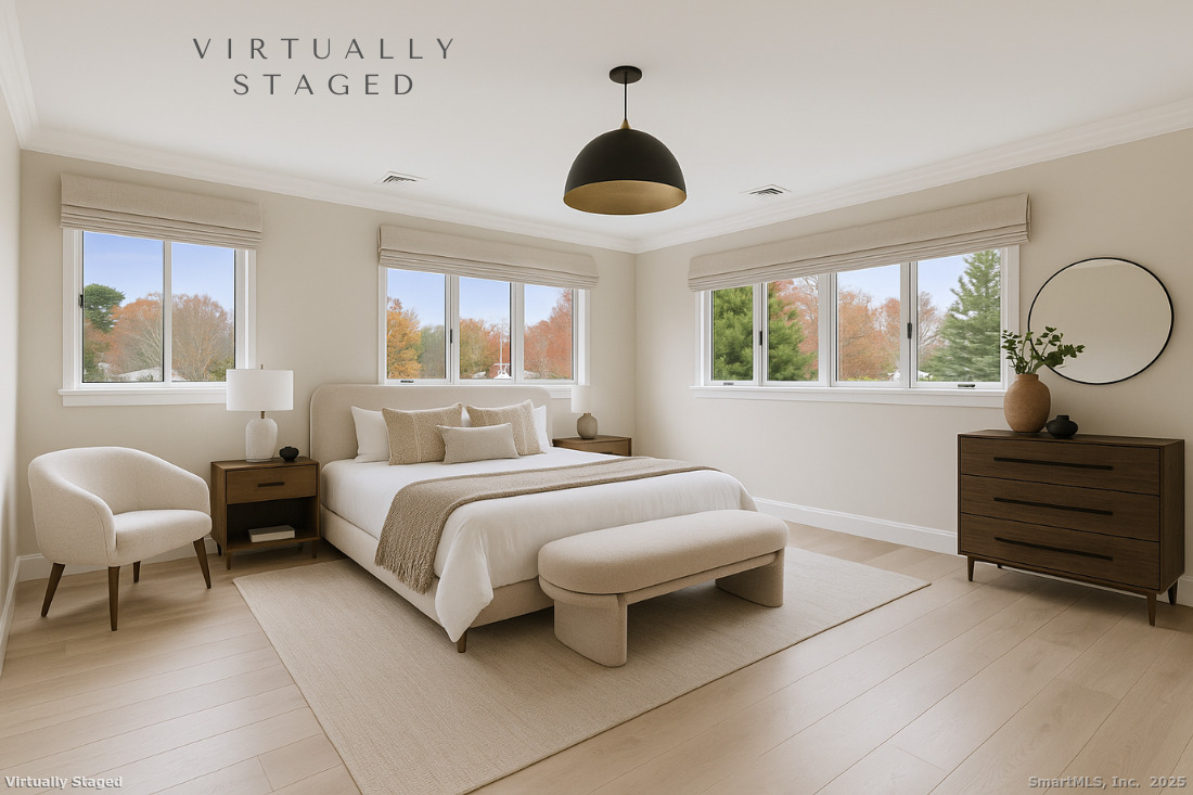 97 Field Point Drive, Unit 97 Fairfield, CT 06824 - Photo 20 of 40 a bedroom with a bed and a window