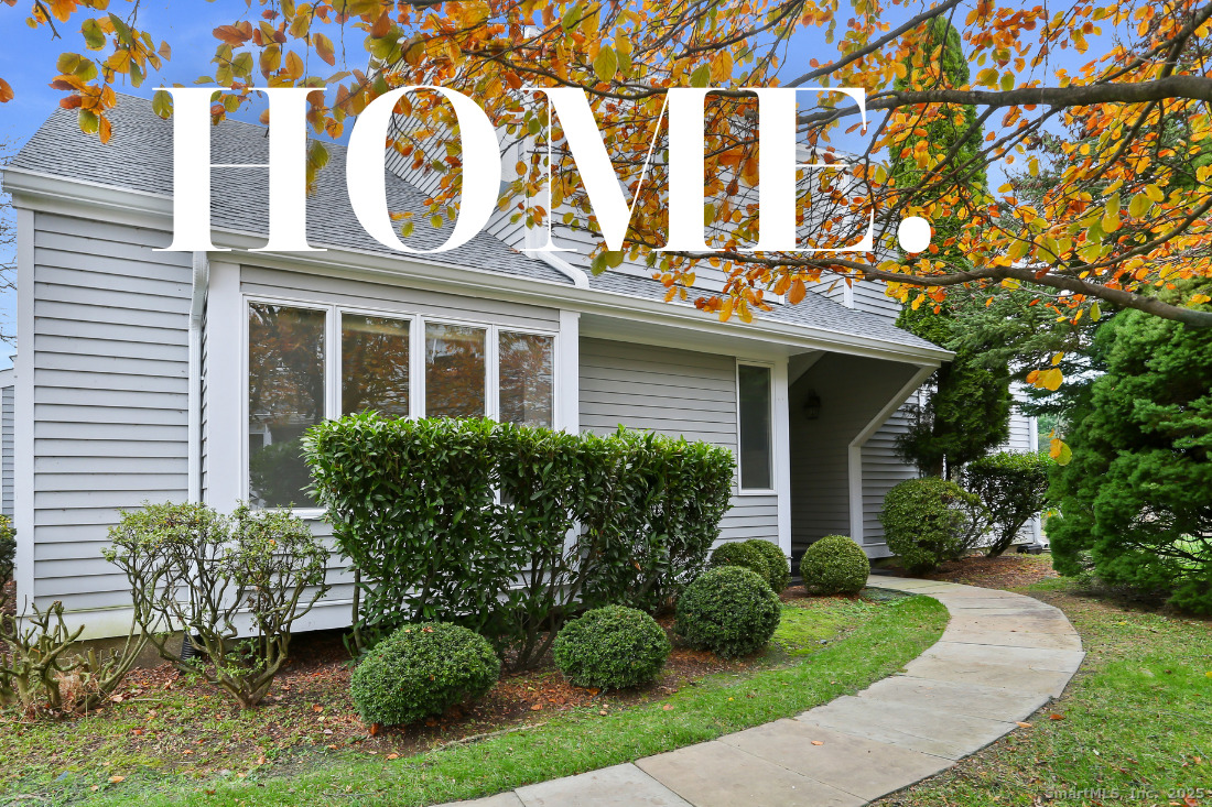 97 Field Point Drive, Unit 97 Fairfield, CT 06824 - Photo 2 of 40 front view of a house with a garden